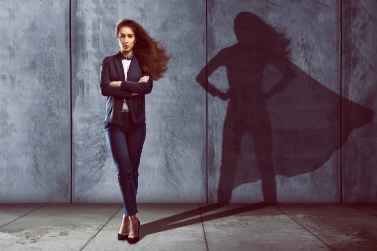 Woman with superwoman shadow behind her to show concept of ghostwriting