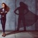 Woman with superwoman shadow behind her to show concept of ghostwriting