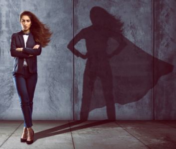 Woman with superwoman shadow behind her to show concept of ghostwriting